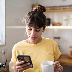 Woman using NCU mobile banking